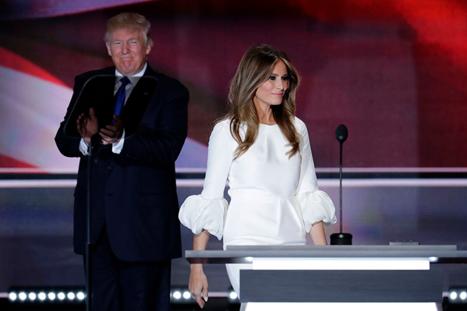 Melania Trump, wife of Republican Presidential Candidate Donald Trump walks to the stage as Donald Trump applaudss during the opening day of the Republican National Convention in Cleveland, Monday, July 18, 2016. (AP Photo/J. Scott Applewhite)