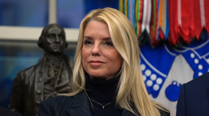 Attorney General Pam Bondi listens as President Donald Trump speaks at an event on addiction recovery in the Oval Office of the White House, Thursday, Jan. 29, 2026, in Washington. (AP Photo/Allison Robbert)