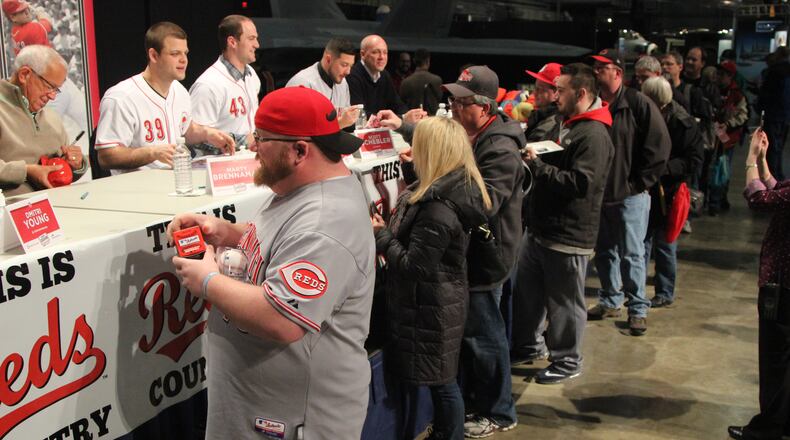 Reds fans getting autographs at the winter caravan stop at the National Museum of the U.S. Air Force in 2017. FILE