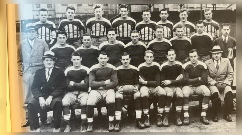 The 1932-33 Dakota Street Football team – posed in front of the Charles Sucher Meat Packing Company where some of the players worked—finished the season unbeaten, as did many of the Dakota Street teams over the years. The Hungarian-based club was the most successful team in the Dayton Daily News-Gem City Semi-Pro League from 1922 to 1941 and it brought great pride to the Hungarian population in Dayton. TOM ARCHDEACON / CONTRIBUTED PHOTO