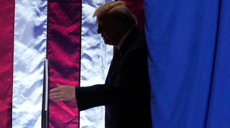President Donald Trump arrives for an event at the Horizon Events Center in Clive, Iowa, Tuesday, Jan. 27, 2026. (AP Photo/Mark Schiefelbein)