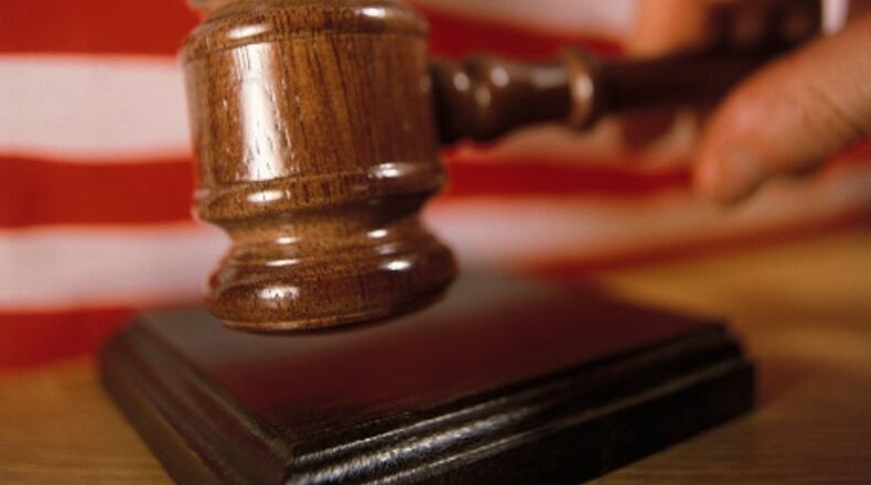 Two former officials of a local government contractor have been charged with conspiracy to defraud the United States government using a program meant to benefit service-disabled veterans.