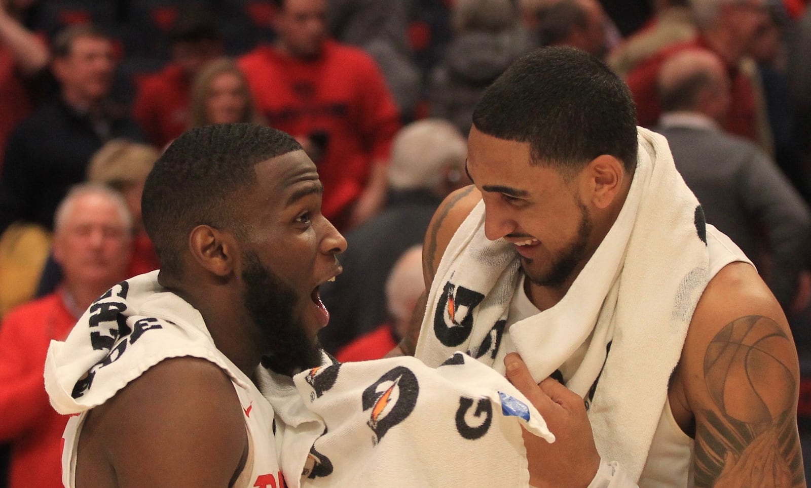 Dayton’s Jalen Crutcher and Obi Toppin smile after a victory against Virginia Commonwealth on Tuesday, Jan. 14, 2020, at UD Arena. David Jablonski/Staff