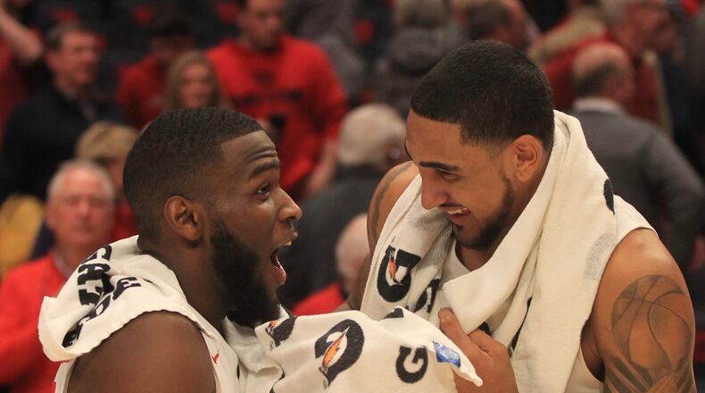 Dayton’s Jalen Crutcher and Obi Toppin smile after a victory against Virginia Commonwealth on Tuesday, Jan. 14, 2020, at UD Arena. David Jablonski/Staff