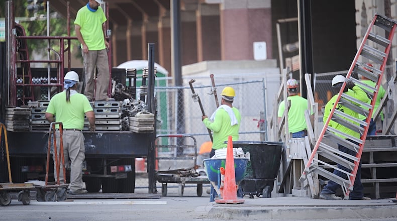 Construction crews continue to work on the arcade building in downtown Dayton. MARSHALL GORBY\STAFF