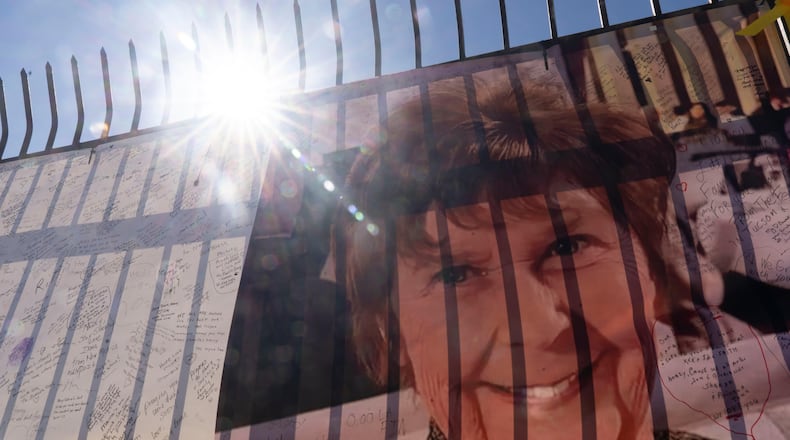 A banner with notes from hundreds of well-wishers and an image of Nancy Guthrie, the missing mother of "Today" show host Savannah Guthrie, outside the KVOA Newsroom in Tucson, Ariz., Friday, March 6, 2026. (AP Photo/Rebecca Noble)
