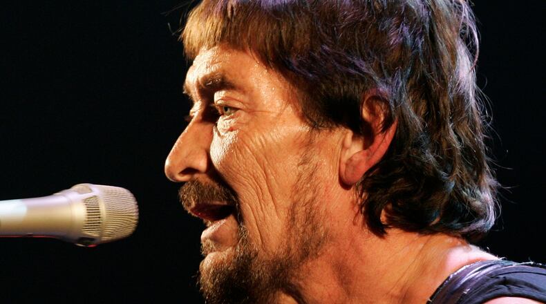 FILE - British rock musician Chris Rea performs during his first German concert of "The Return of the Fabulous Bluenotes" tour in Munich, Germany, on Feb. 7, 2008. (AP Photo/Christof Stache, File)