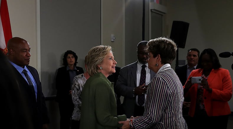 ORLANDO, FL - JULY 22: Democratic presidential candidate former Secretary of State Hillary Clinton greets attendees during a round table discussion at Holden Heights Community Center on July 22, 2016 in Orlando, Florida. With three days to go until the Democratic National Convention, Hillary Clinton is campaigning in Florida. (Photo by Justin Sullivan/Getty Images)