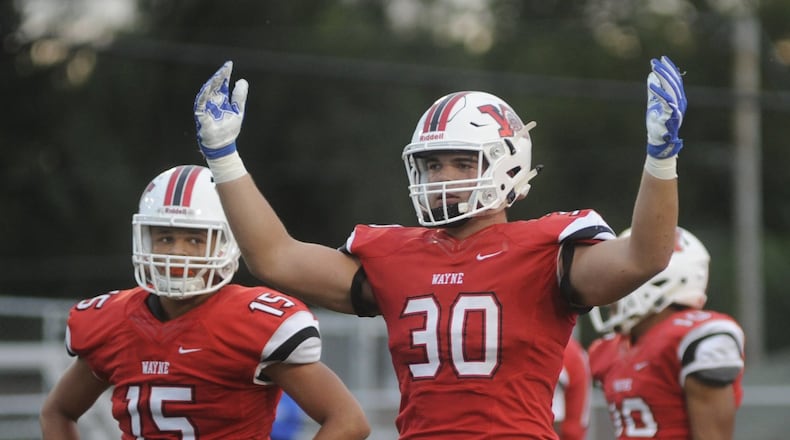 Wayne’s Alex Reigelsperger motions for more crowd noise. Wayne defeated visiting Miamisburg 56-28 in a Week 4 GWOC crossover high school football game on Friday, Sept. 15, 2017. MARC PENDLETON / STAFF