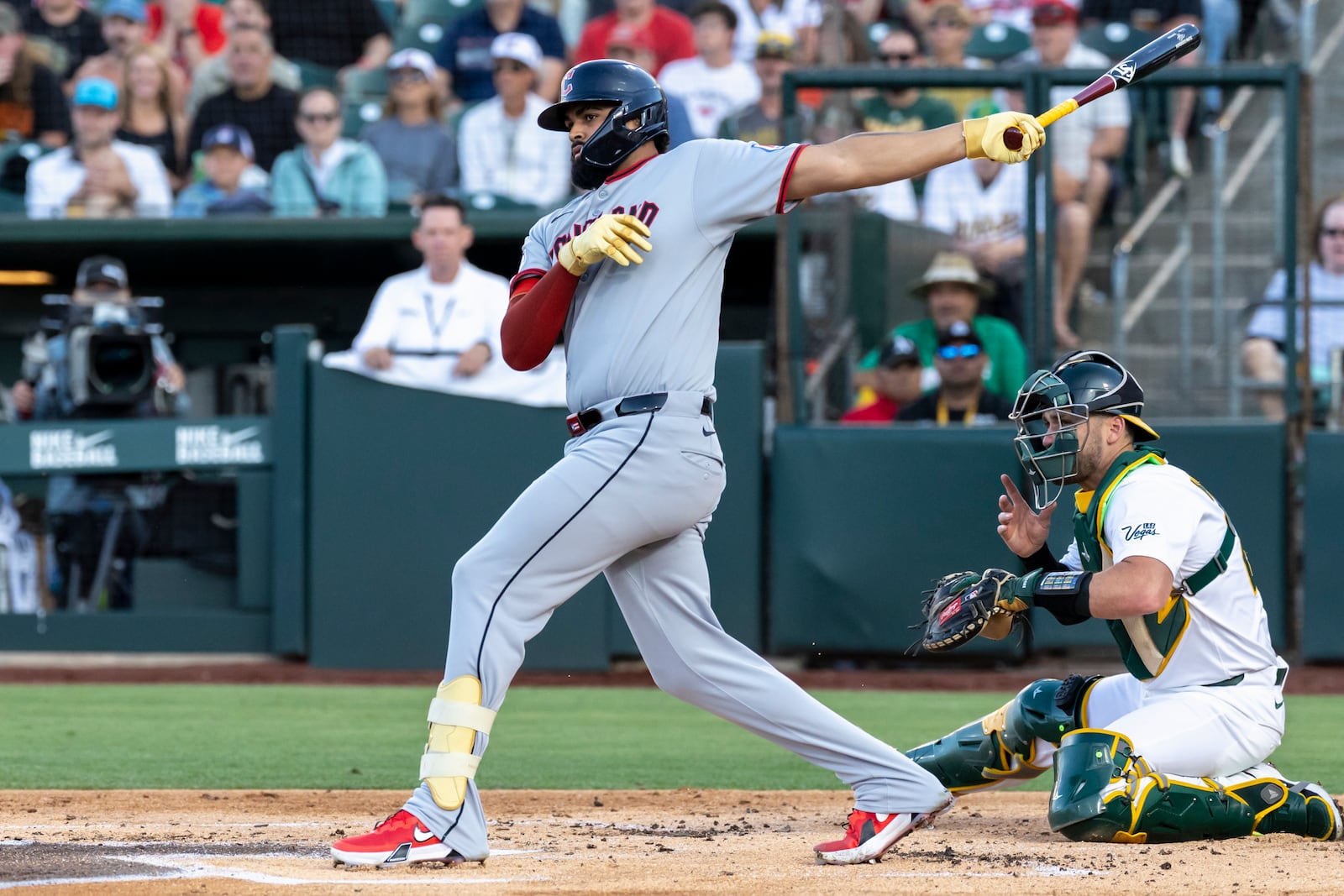 Cleveland Guardians' Johnathan Rodríguez (30) with an RBI double during the second inning of a baseball game against the Athletics Saturday, June 21, 2025, in West Sacramento, Calif. (AP Photo/Sara Nevis)