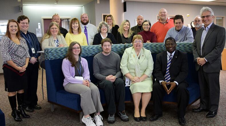 D’Azzo Research Library staff and leadership gathered in honor of National Library Worker’s Day in April 2018. The joint Air Force Institute of Technology/ Air Force Research Laboratory library received the 2019 Federal Library/Information Centers of the Year award in the large library/information center category. (U.S. Air Force photo/Katie Scott)