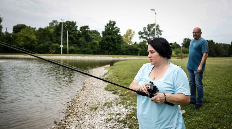 Lillie and Anthony Bohannon fish at the pond at Miami View Park on Munger Road in Miami Twp. Tuesday, Aug. 8, 2023. The township is asking residents and non-residents for input regarding the community's first-ever park plan. JIM NOELKER/STAFF