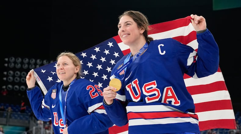 United States' Kendall Coyne, left, and United States' Hilary Knight celebrate after victory ceremony for women's ice hockey at the 2026 Winter Olympics, in Milan, Italy, Thursday, Feb. 19, 2026. (AP Photo/Hassan Ammar)