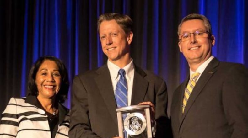 Mike Manzler, associate general counsel at Wright State University, received the 2018 Ruth W. and Robert I. Westheimer Award for Continuous United Way Leadership. He is pictured with Yvonne Gray Washington, retired executive vice president and COO of United Way of Greater Cincinnati, left, and Thomas Vaughan, chair of the Volunteer Connection Leadership Council.