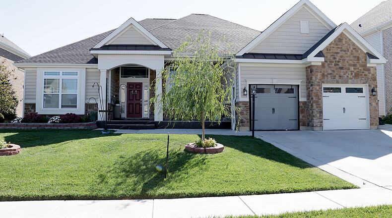 The ranch has about 5,160 sq. ft. of living space and is located in the Lakes of Carriage Trails. A front patio extends from the covered front porch, and a full kitchenette is in the 2-car garage, which also has extra storage and faux flooring treatment. CONTRIBUTED PHOTO BY KATHY TYLER