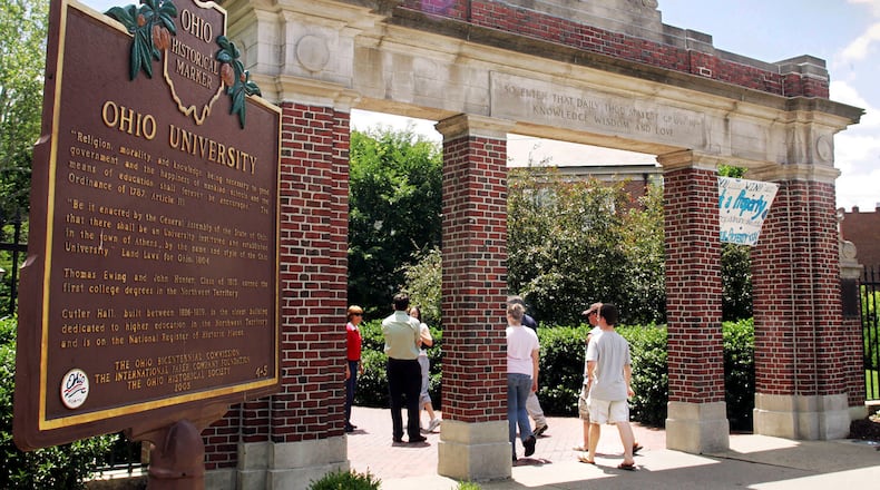 FILE - A historical marker stands near the gate at the Ohio University campus in Athens, Ohio on June 12, 2006.  Universities that adopted COVID-19 vaccine mandates this fall of 2021, have seen widespread compliance. That's true even though many schools made it easy to get out of the shots by granting exemptions to nearly any student who requested one. (AP Photo/Joe Maiorana, File)