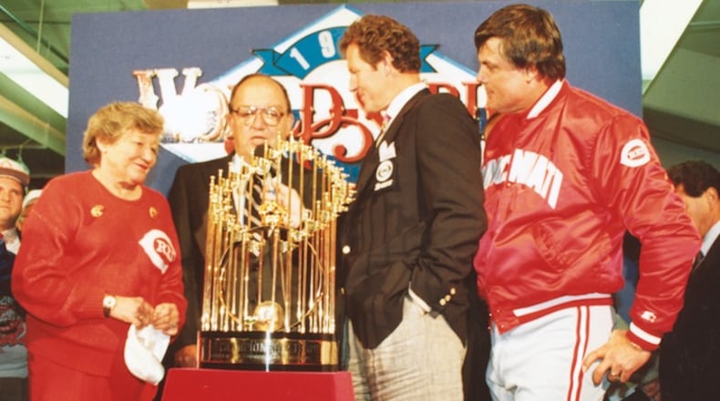 Presentation of the World Series trophy on October 20, 1990. From left, Reds owner Marge Schott, MLB Commissioner Fay Vincent, CBS announcer Jim Kaat and Reds manager Lou Piniella. (Photo courtesy Cincinnati Reds/TNS)
