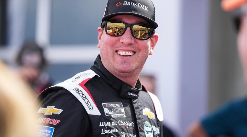FILE - Kyle Busch smiles prior to a NASCAR Cup Series auto race at Charlotte Motor Speedway, Sunday, Oct. 5, 2025, in Concord, N.C. (AP Photo/Matt Kelley, File)