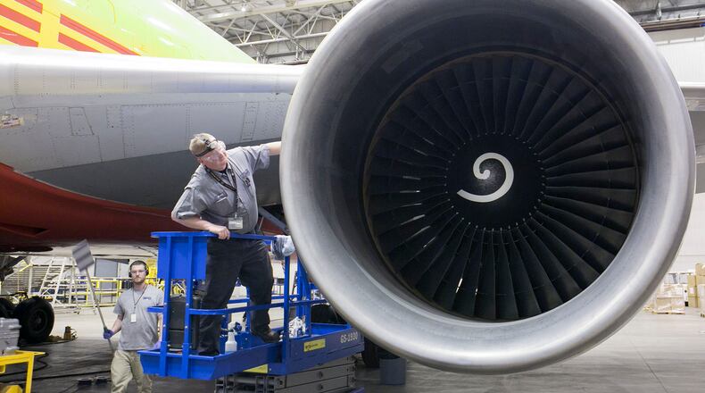 Aircraft and Powerplant mechanic Scott Yancey inspects the intake area of a GE CF-6 engine mounted on a Boeing 767-200 for Airborne Maintenance and Engineering Services at the Wilmington Air Park in this 2015 file photo.