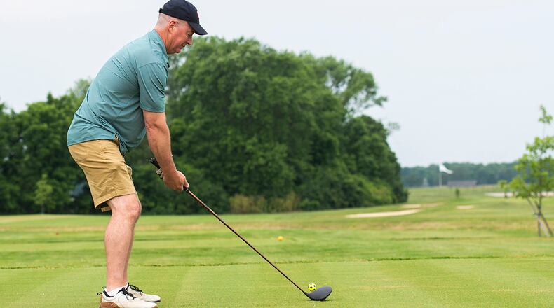 Col. Paul Burger, 88th Mission Support Group commander, along with other distinguished visitors, cut the ribbon on newly designed holes 7 and 8 at Prairie Trace Golf Course during a ceremony June 25 at Wright-Patterson Air Force Base. It marked Phase I completion in a multimillion-dollar project that required relocation of the previous holes to make room for expansion of the National Air and Space Intelligence Center. U.S. AIR FORCE PHOTO/WESLEY FARNSWORTH