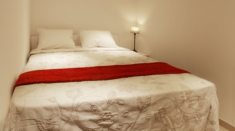 Want to get that plush hotel look? Try going all white: walls, ceiling, floors, furniture, and, most importantly, bedding. (Dreamstime)