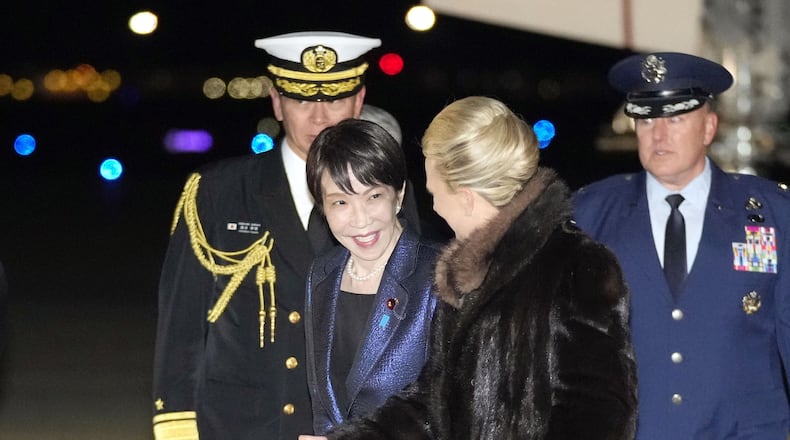 Japanese Prime Minister Sanae Takaichi, center, arrives at Joint Base Andrews, Md. Wednesday, March 18, 2026. (Yuki Sato/Kyodo News via AP)