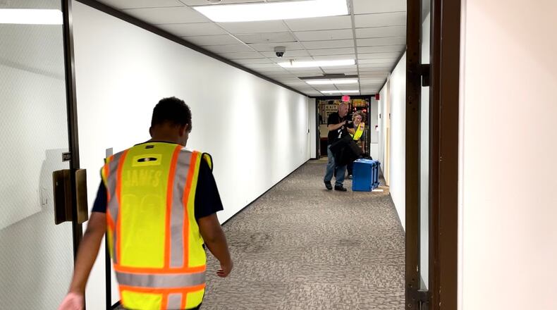 An election volunteer walks back to the Montgomery County administrative garage, where ballot boxes and bags are waiting.