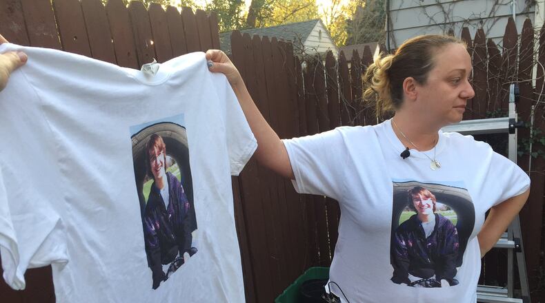 Jessica Combs, mother of Ronnie Bowers, holds a T-shirt with her son’s photo. NATALIE JOVONOVICH / STAFF