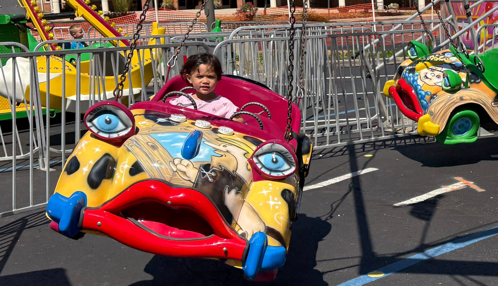 Juliette Murphy, 3, of Centerville is enjoying one of the kids rides Saturday, Aug. 30, 2025, at AlterFest in Kettering. JEN BALDUF/STAFF