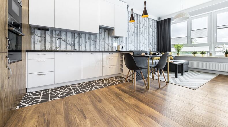 In 2019, we ll be mixing more natural-looking materials into our modern designs and hiding our appliances for a cleaner look. (Dreamstime)