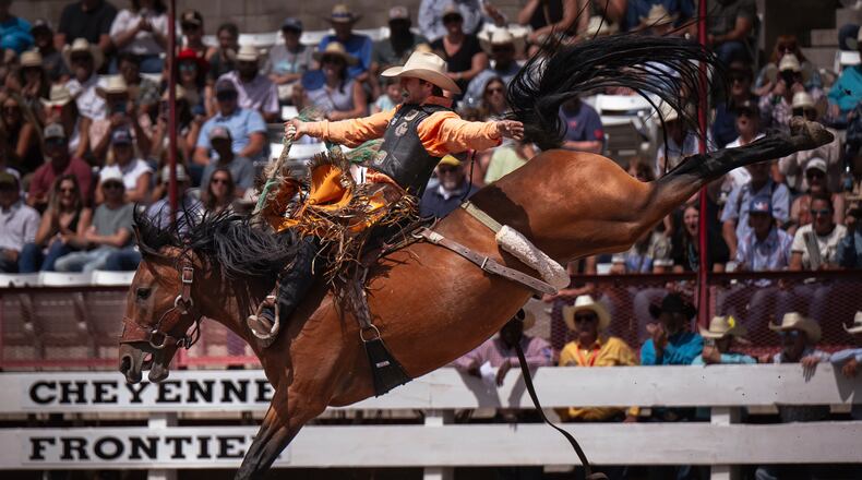 FILE - Brody Cress, of Hillsdale, Wyo., competes in saddle bronc riding during the 129th anniversary Cheyenne Frontier Days Rodeo on Championship July 27, 2025, in Frontier Park Arena. (Milo Gladstein/The Wyoming Tribune Eagle via AP, File)