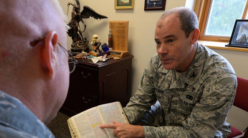 Chaplain (Col.) Ted Wilson, 88th Air Base Wing chaplain, provides spiritual counsel to Tech. Sgt. Daniel Thornton, 88th Air Base Wing bioenvironmental engineer, at Wright-Patterson Air Force Base July 12. The 88 ABW Chaplain Services provide spiritual care and advising leadership to develop spiritually fit Airmen and families. (U.S. Air Force photos/Michelle Gigante)