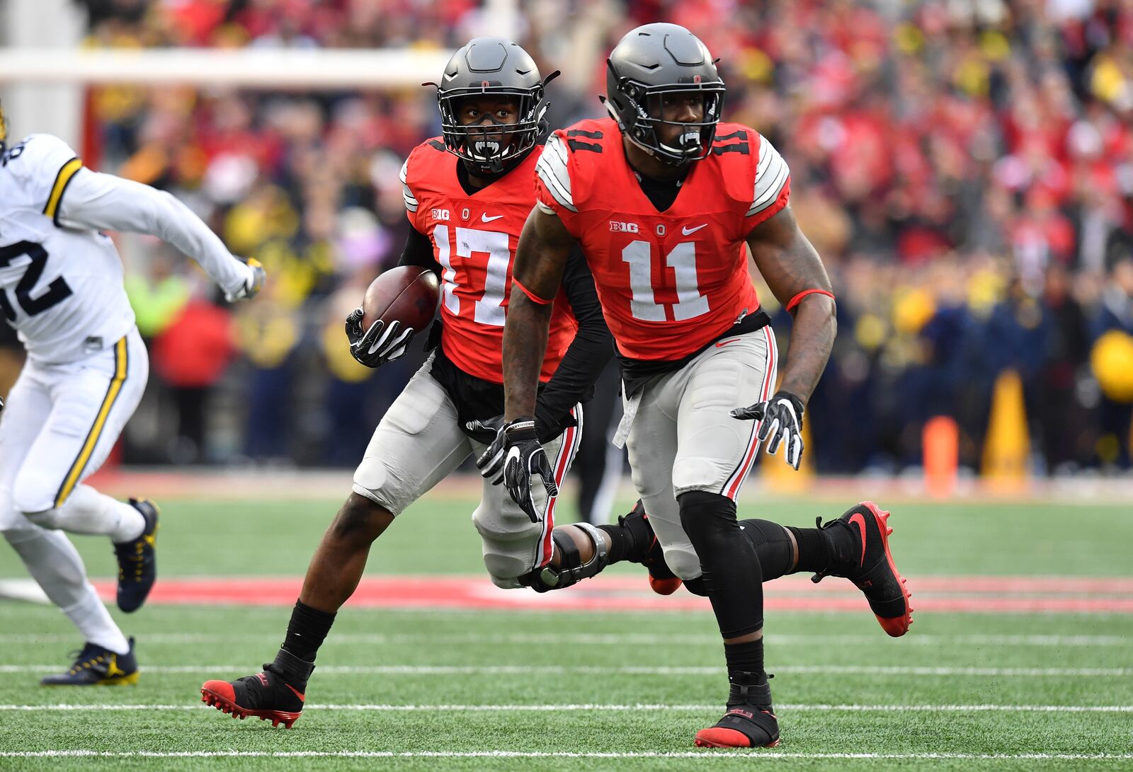  COLUMBUS, OH - NOVEMBER 26: Jerome Baker #17 of the Ohio State Buckeyes runs with the ball after intercepting a pass during the second half against the Michigan Wolverines at Ohio Stadium on November 26, 2016 in Columbus, Ohio. (Photo by Jamie Sabau/Getty Images)