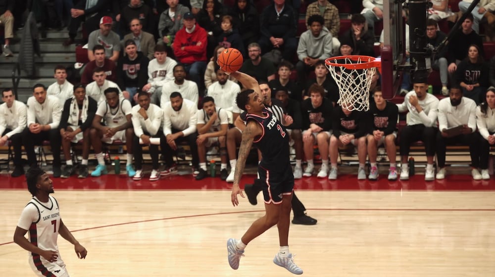 Dayton's De'Shayne Montgomery dunks in the first half against Saint Joseph’s on Saturday, Jan. 24 2026, at Hagan Arena in Philadelphia. David Jablonski/Staff
