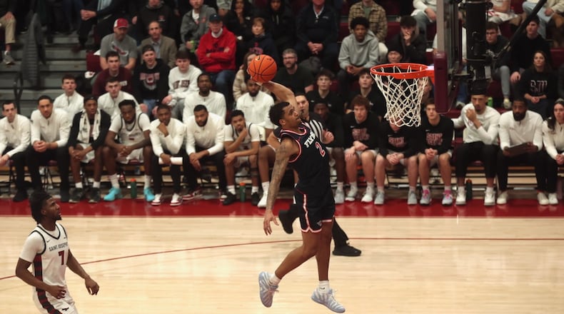 Dayton's De'Shayne Montgomery dunks in the first half against Saint Joseph’s on Saturday, Jan. 24 2026, at Hagan Arena in Philadelphia. David Jablonski/Staff