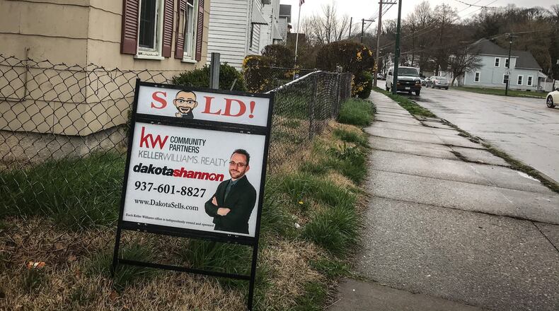 A house that recently sold on Wayne Ave in Dayton. Realtors say that people are still looking for and buying houses in the midst of the COVID-19 crisis but things are slowing down some. JIM NOELKER/STAFF