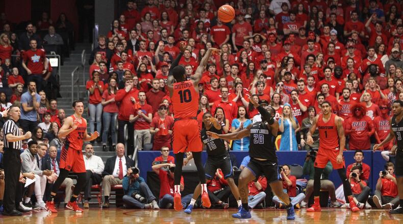Dayton’s Jalen Crutcher makes a go-ahead 3-pointer in the final seconds of the first half against Saint Louis on Saturday, Jan. 23, 2019, at UD Arena. David Jablonski/Staff