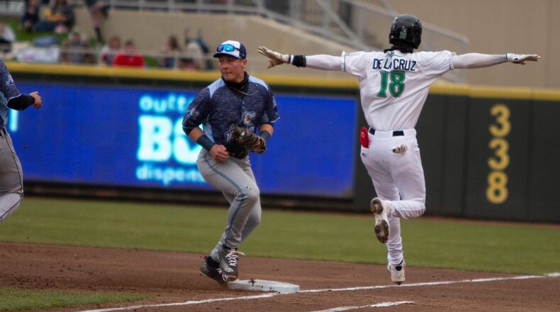 Dayton's Elly De La Cruz signals himself safe on an infield hit during Wednesday's game against West Michigan at DayAir Ballpark. Jeff Gilbert/CONTRIBUTED