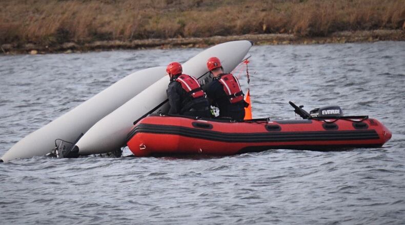 A man and his dog were rescued from Eastwood Lake after their catamaran capsized Nov. 19, 2020. MARSHALL GORBY\STAFF