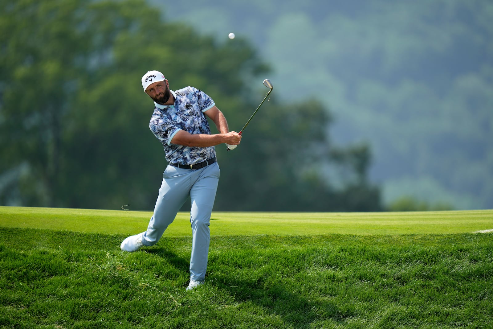 Jon Rahm, of Spain, plays his ball on the 17th hole during the first round of the U.S. Open golf tournament at Oakmont Country Club Thursday, June 12, 2025, in Oakmont, Pa. (AP Photo/Seth Wenig)