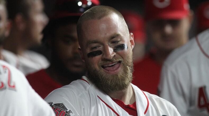 Reds catcher Tucker Barnhart smiles in the dugout after a home run against the Angels on Tuesday, Aug. 6, 2019, at Great American Ball Park in Cincinnati. David Jablonski/Staff