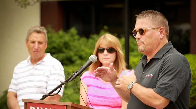 Steve Risner, owner of HR Associates Personnel Services in Piqua speaks of his own circumstances during a Pay Us Back Ohio BWC Inc. press conference at the Bureau of Workers Compensation Thursday. The organization is mobilizing statewide and asking Gov. John Kasich to drop the case and cut the checks. Business owners and others are pressuring the Kasich administration to order the Ohio Bureau of Workers' Compensation to pay back $860 million to 270,000 employers that the courts have said were overcharged for workers' comp coverage between 2001 and 2008. JIM WITMER / STAFF