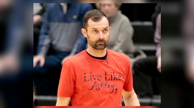 Tippecanoe girls basketball head coach Brett Kopp wears a T-shirt in memory of Ashlyn Flynn, which the entire Tipp team had on during pregame warmups on Tuesday, March 3, 2026. STEVEN WRIGHT / STAFF