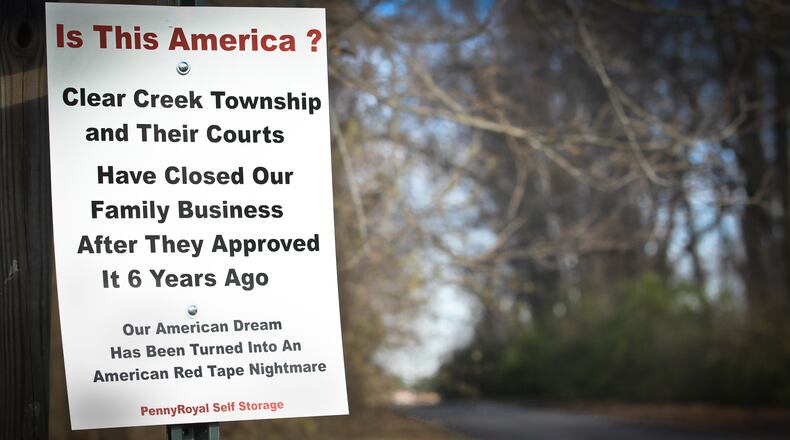 A sign at the entrance to PennyRoyal Self Storage. Howard and Lisa Gray had permission to use their residential driveway in Warren County to get to garages and storage facilities on the Montgomery County portion of their land....Still the couple is facing contempt of court charges and civil fines for the third time in a five-year dispute over continued access with Clearcreek Township officials, responding to complaints from neighbors.