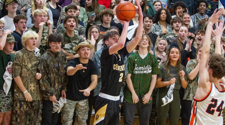 Centerville junior Eli Greenberg shoots over Beavercreek's Landon Casewell in front of the Beavercreek student section Tuesday night at Ed Zink Fieldhouse. Jeff Gilbert/CONTRIBUTED