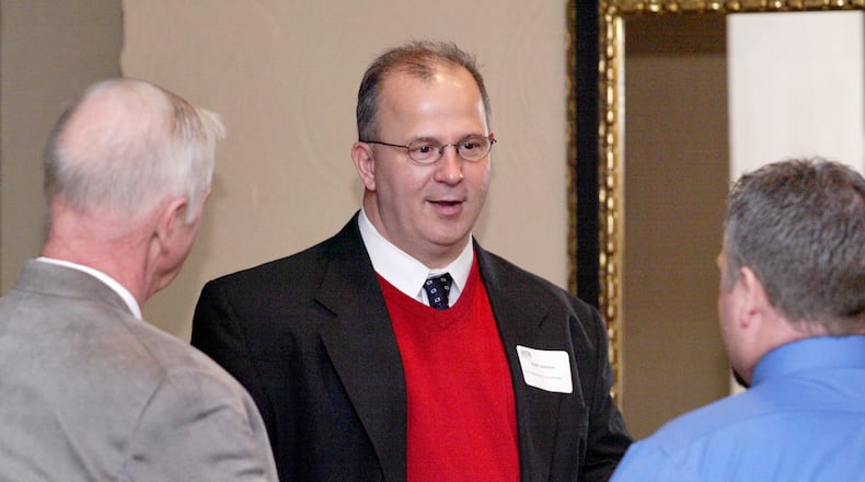 Vern Oakley of Miller-Valentine Group and Miamisburg City Manager Keith Johnson, center, during the Dayton Area Chamber of Commerce Breakfast Briefing in 2012.