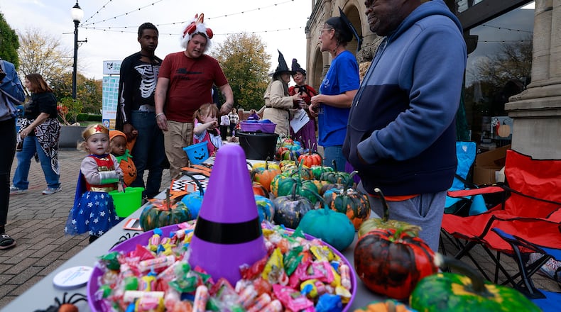 Hundreds of creepy and cute characters filled the sidewalks and streets in downtown Springfield for the seventh annual Downtown Springfield Trick or Treat Friday, Oct. 25, 2024. Downtown merchants, community organizations and nonprofits passed out candy, Halloween characters roamed the sidewalks and danced in the street. BILL LACKEY/STAFF