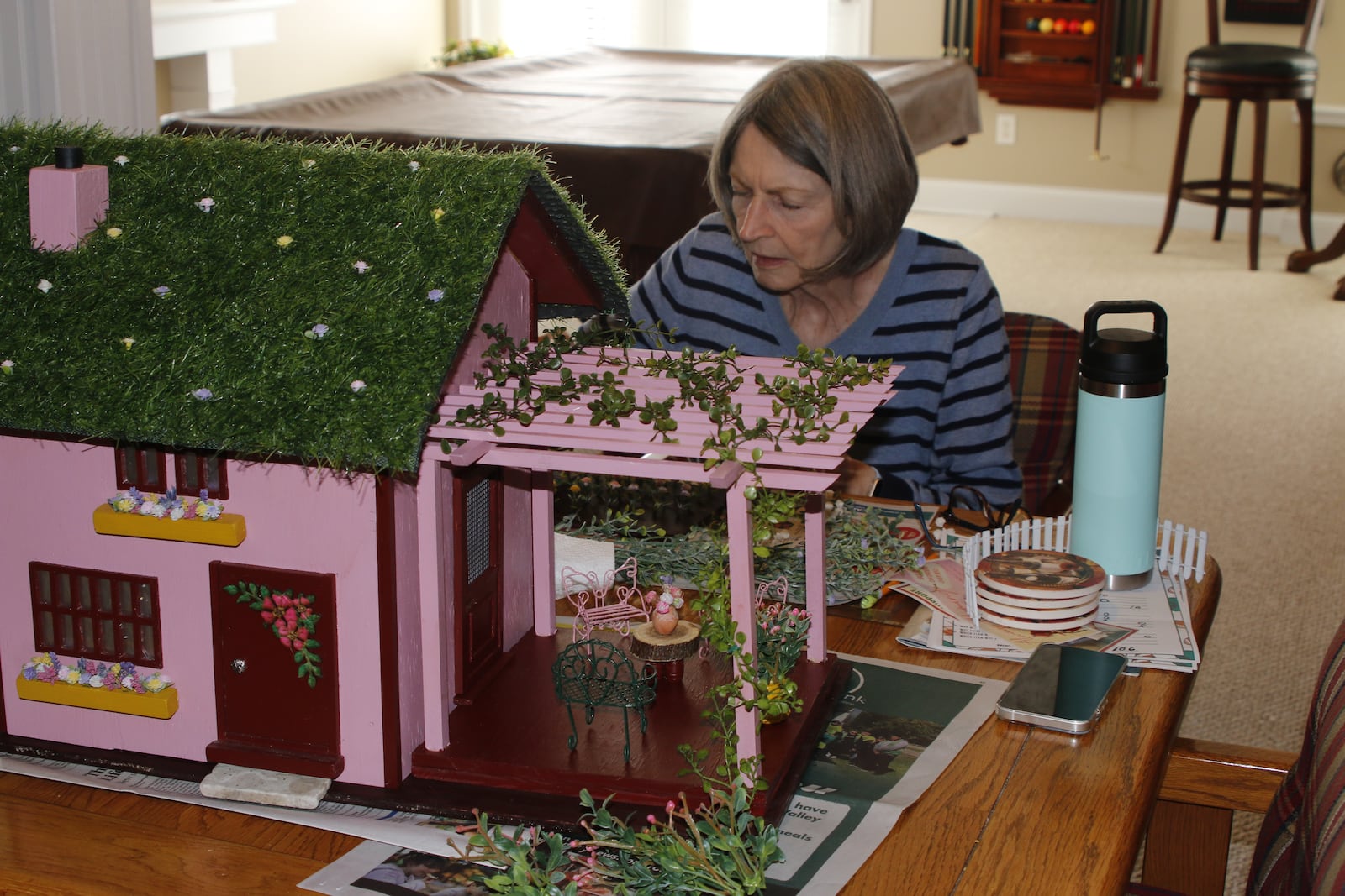 Kathy Andersen works on her faerie house.
Photo: Dave Andersen.