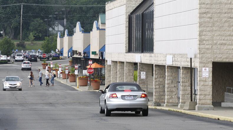 The developer of Austin Landing has released detailed plans for a proposed development that could be built on land around the former Kroger on Ohio 48, something celebrated by Centerville officials. This view looking south shows the now old closed and empty Kroger in Centerville Place. TY GREENLEES / STAFF