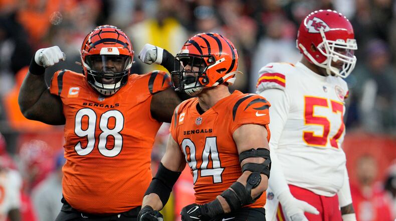 Cincinnati Bengals defensive end Sam Hubbard (94) and defensive tackle DJ Reader (98) celebrate a sack against the Kansas City Chiefs in the first half of an NFL football game in Cincinnati, Sunday, Dec. 4, 2022. (AP Photo/Jeff Dean)